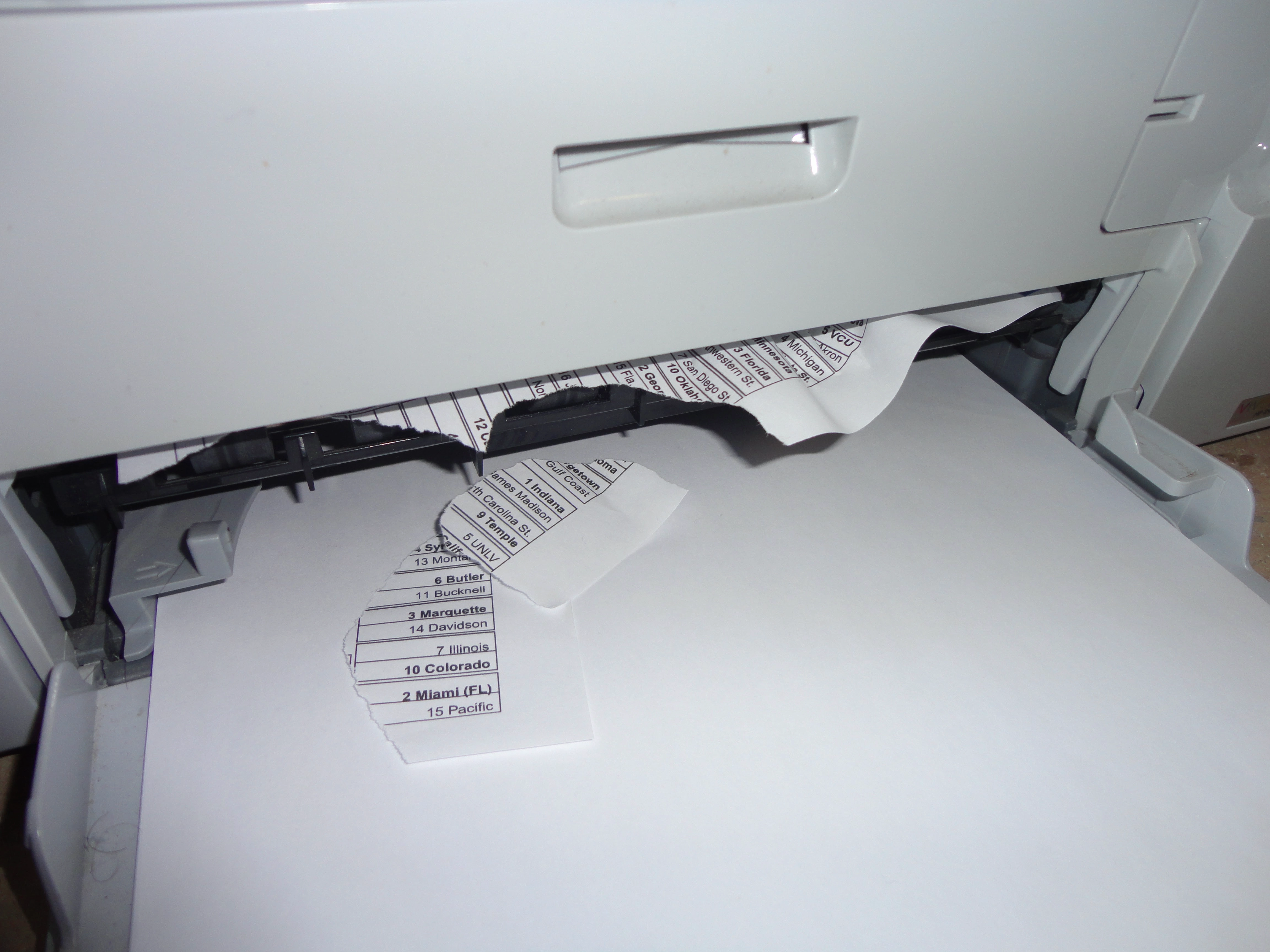 An old HP Deskjet jams while trying to print out a bracket for March Madness 2013. All I wanted to do was make some brackets...